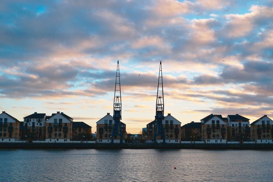 Modern new-build residential development along a London waterfront