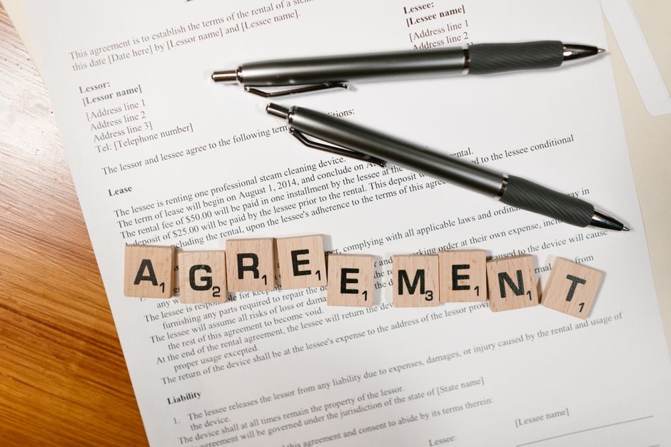 Property lease documents being reviewed — a critical step when comparing London new-build developments