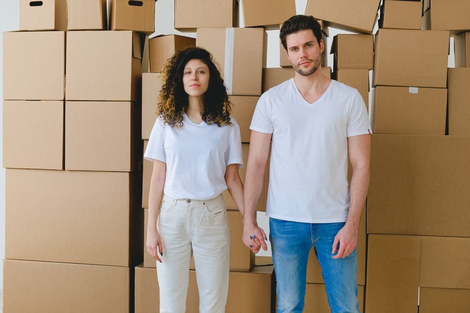 A family moving into a new home with packing boxes