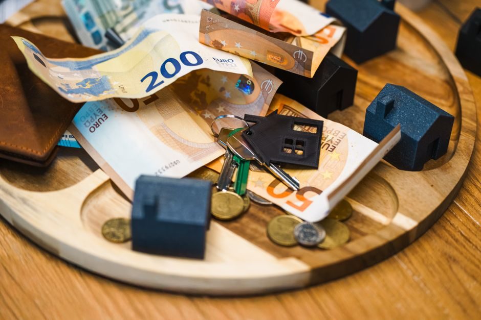 UK house keys resting on mortgage paperwork