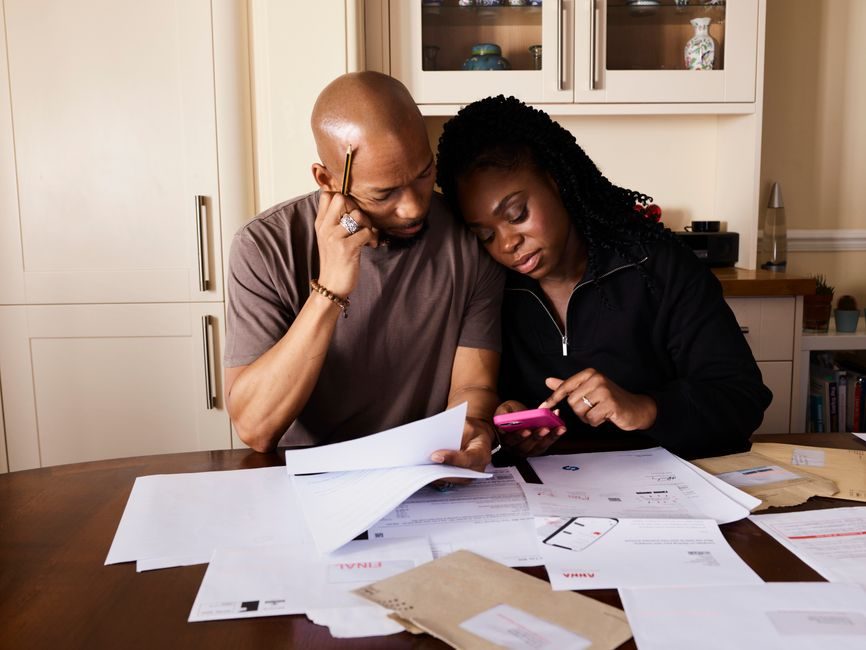 A family reviewing property purchase documents together