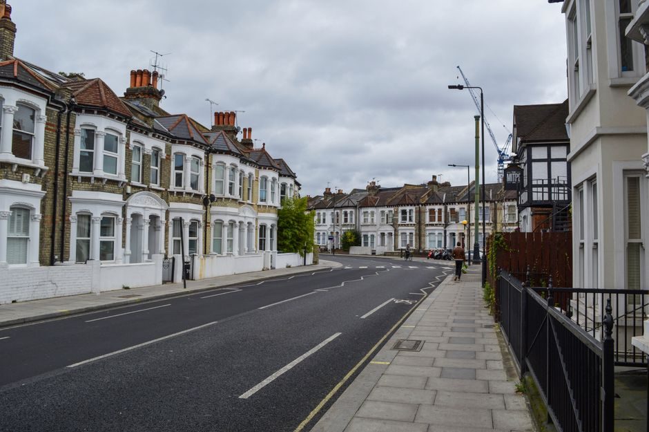 A quiet residential street of terraced houses in London