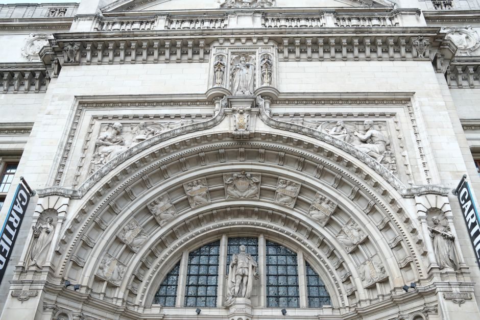 Close-up view of an ornate architectural arch adorned with intricate sculptures and reliefs.
