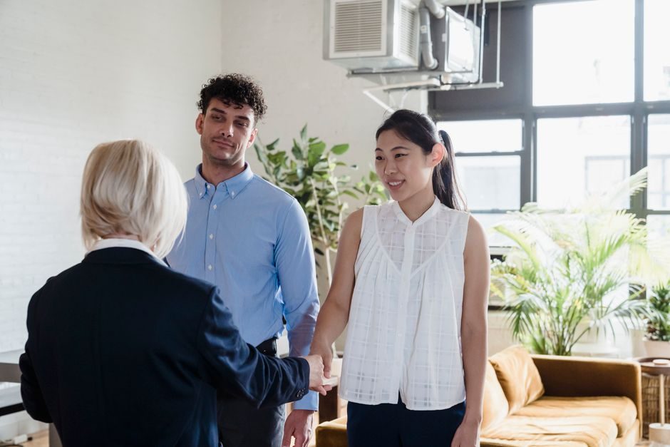 A letting agent reviewing documents with a landlord client