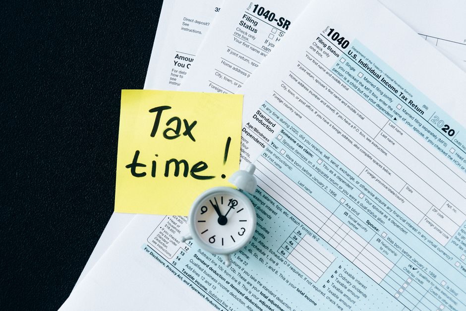 UK HMRC tax forms and documents spread on a desk