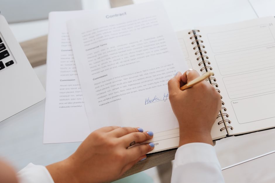 A solicitor's desk with UK property sale documents, highlighting the legal and tax implications of joint ownership structures