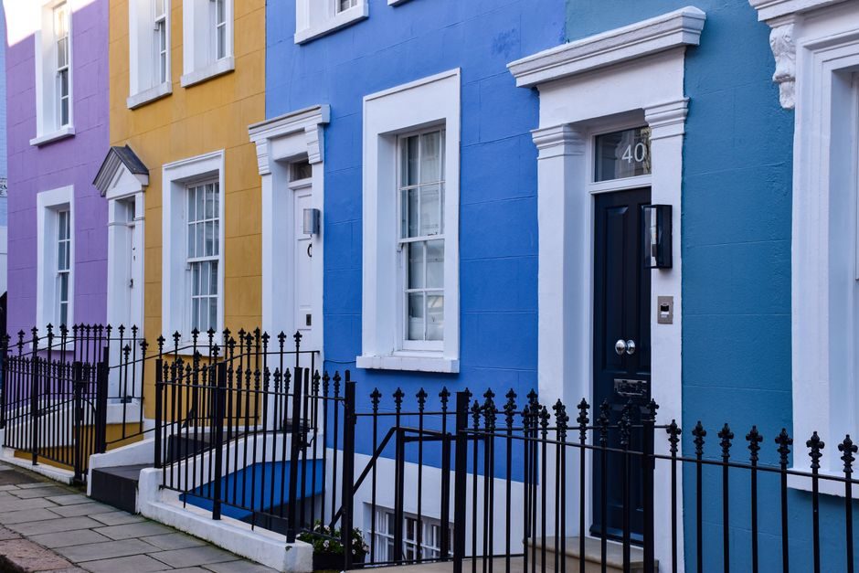 Vibrant facades of London townhouses in Notting Hill, showcasing architectural charm.