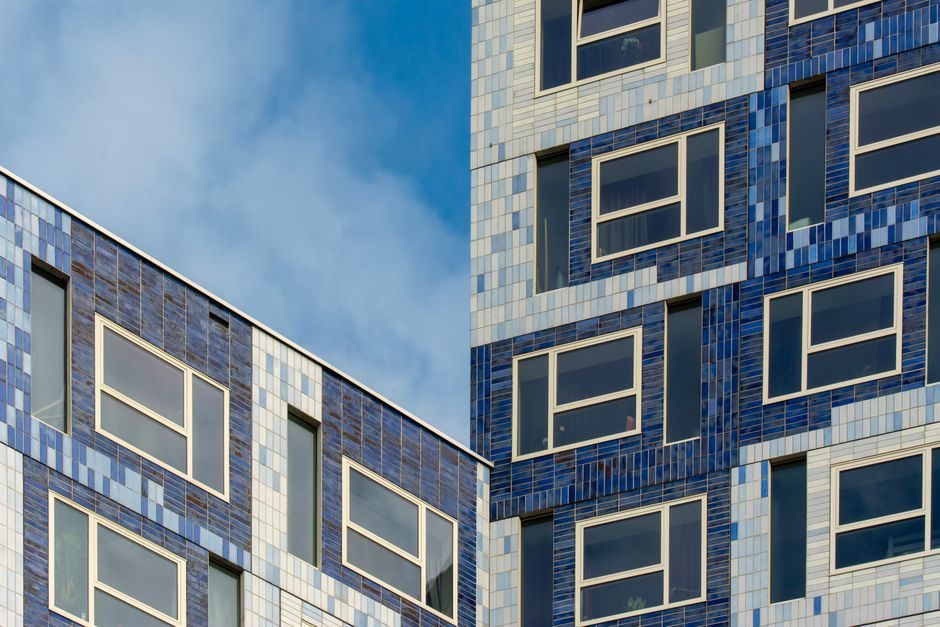 A modern London apartment building near a university, suitable for a student buyer