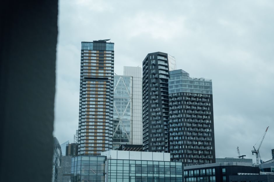 View of modern skyscrapers under cloudy sky in London, UK