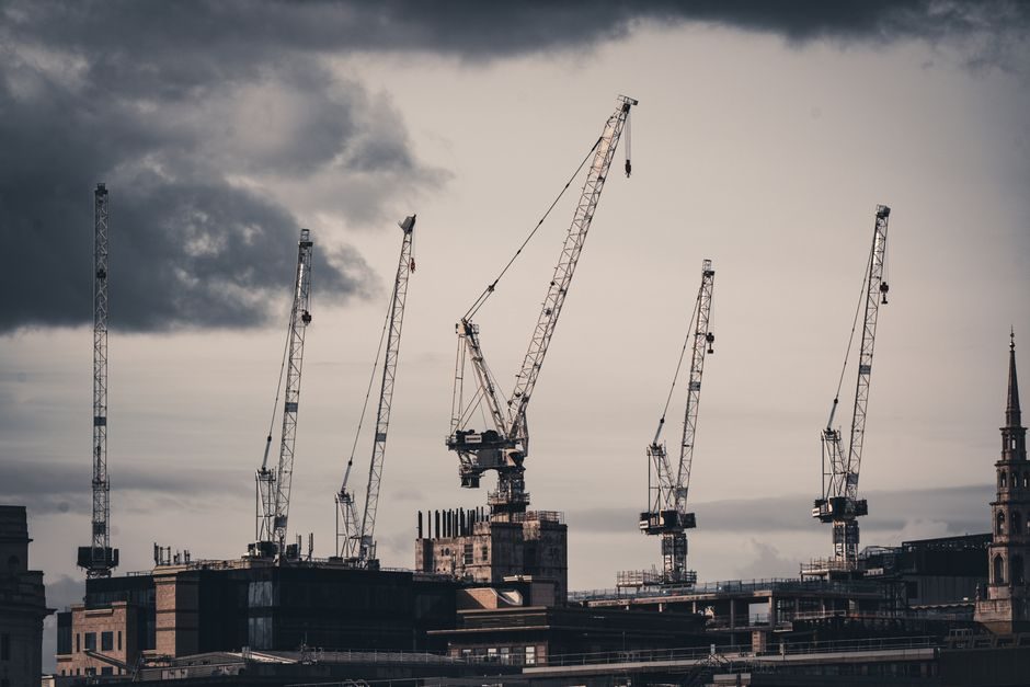 Construction cranes over a London regeneration zone