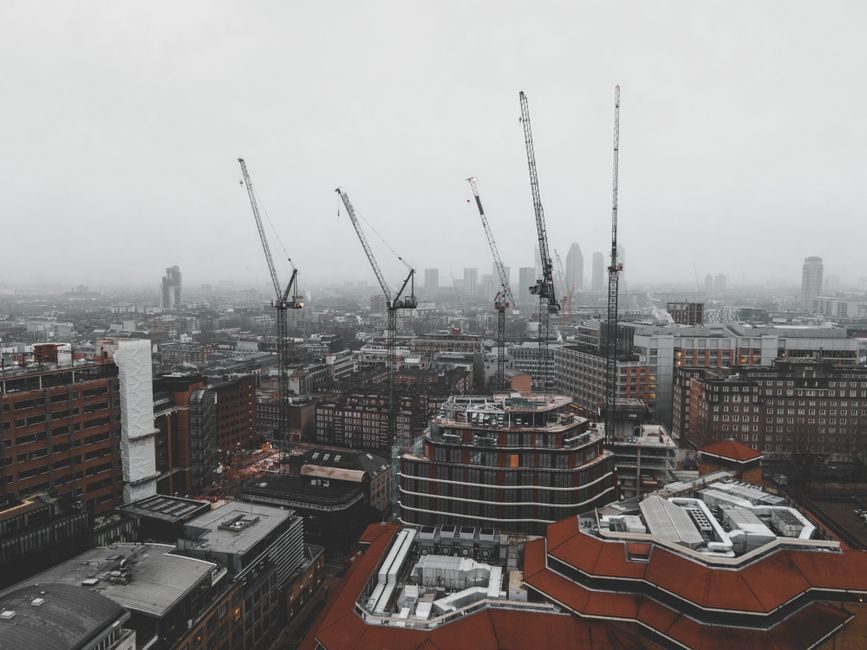 Construction cranes above a London regeneration area