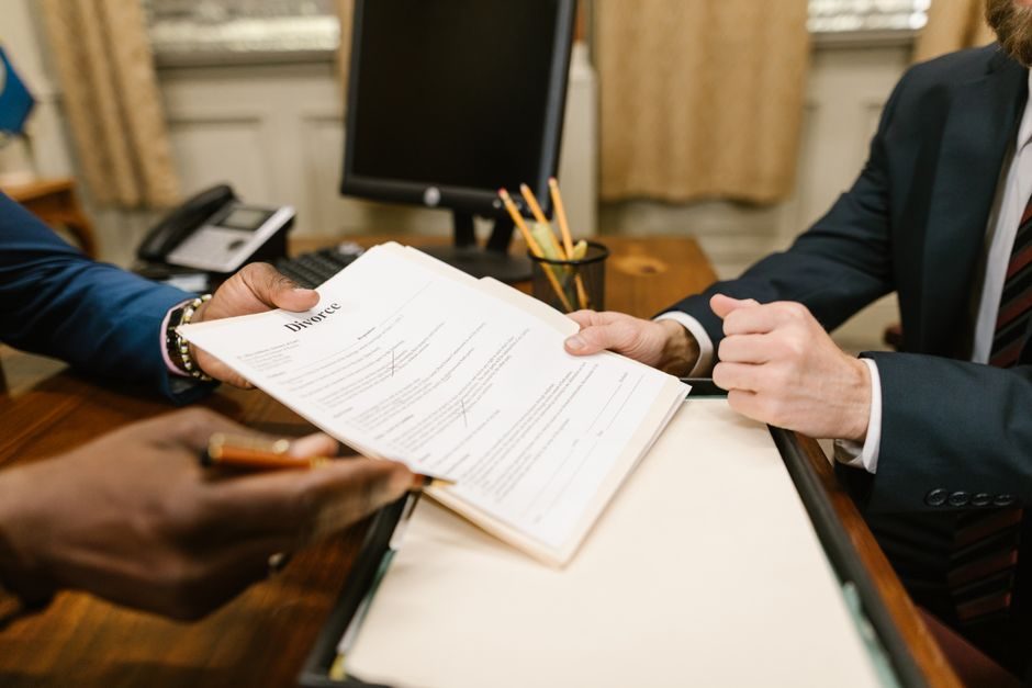 A solicitor reviewing and signing a UK property contract at exchange of contracts