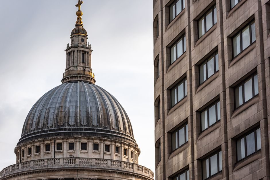 Stunning juxtaposition of St Paul's Cathedral and adjacent modern building in London, UK.