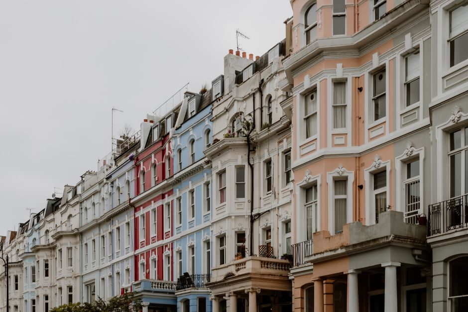 Explore the charm of colorful Victorian row houses lining a city street, showcasing urban elegance.